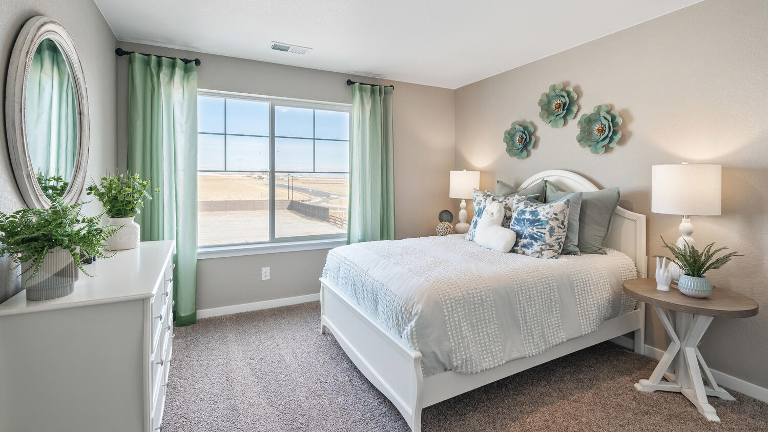 Secondary upper floor bedroom with large window for ample natural light and plush carpeting