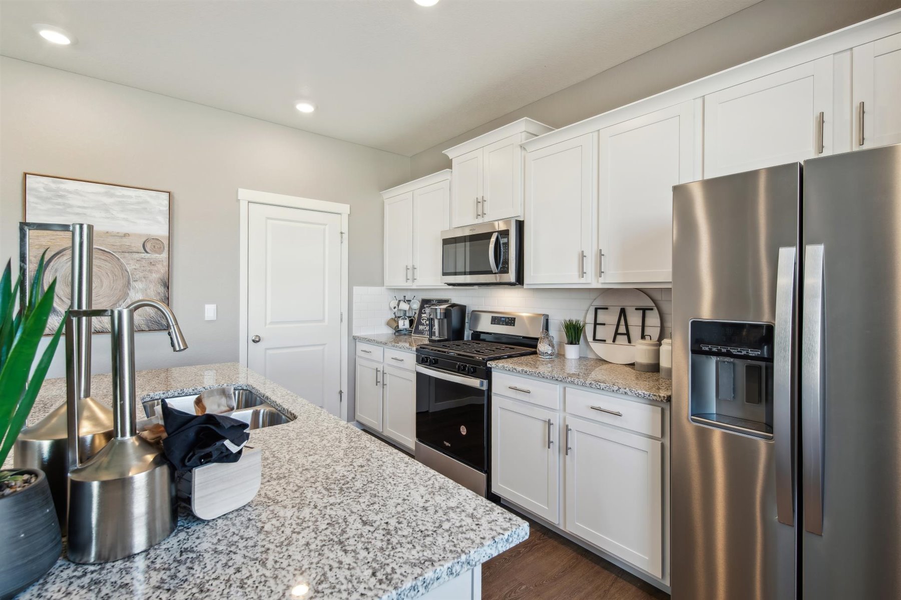 Designer kitchen cabinets and generously sized island for ample storage