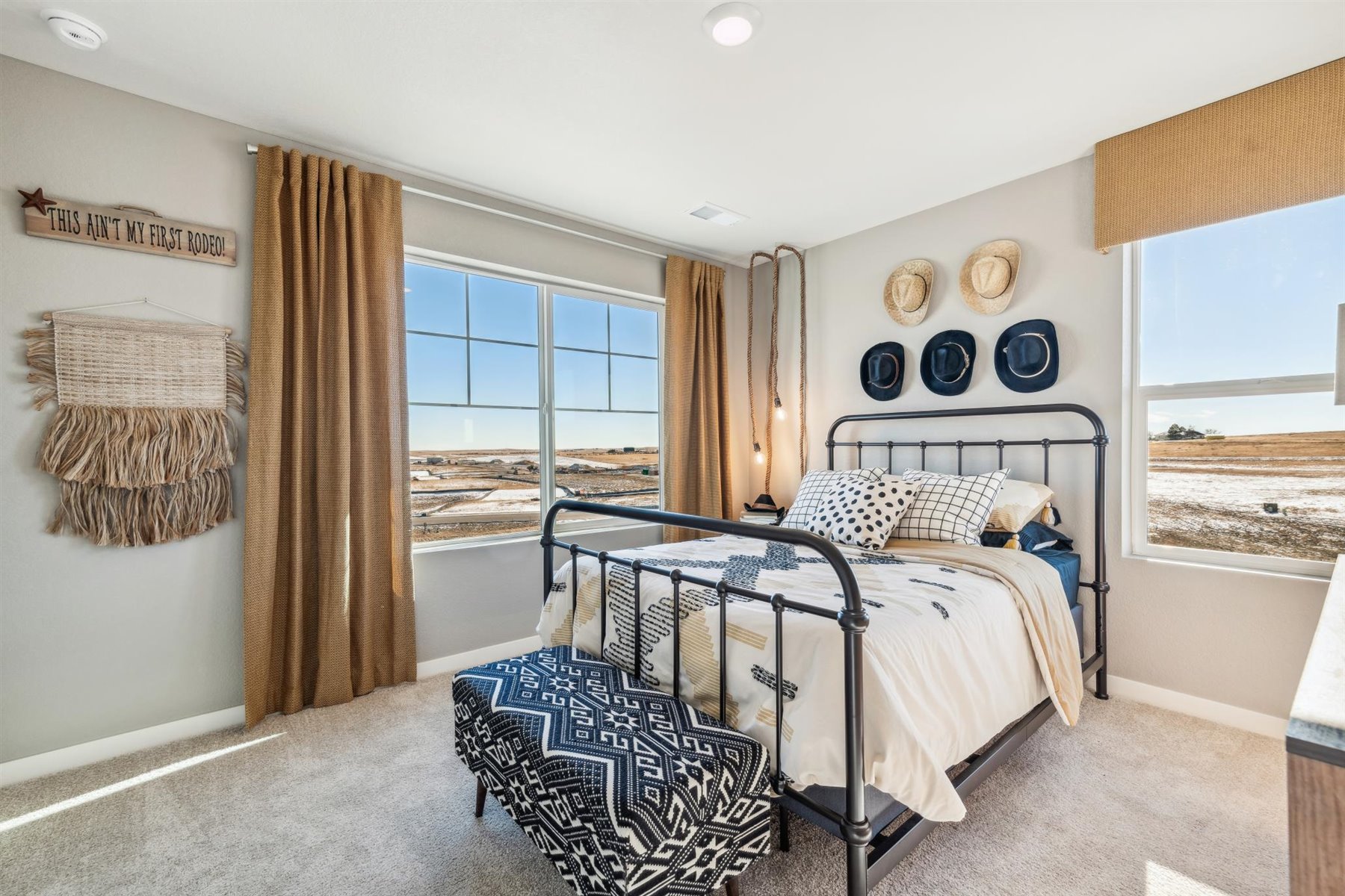 Secondary bedroom on upper floor with plenty of natural light from large windows