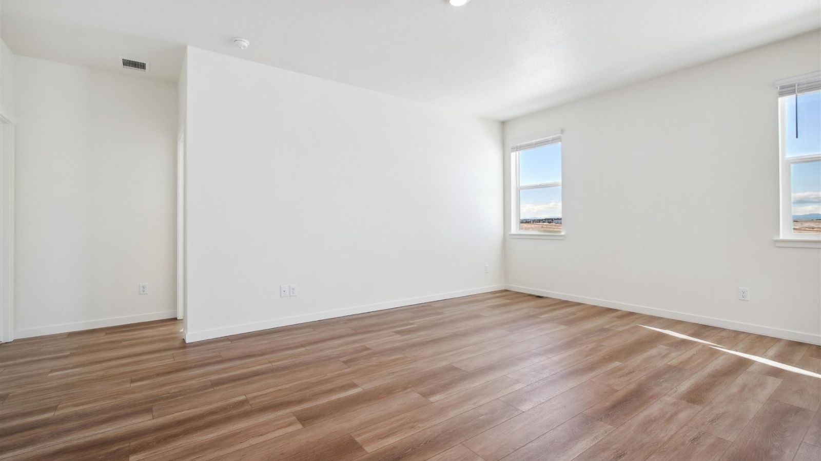 Living room with large windows in new construction home