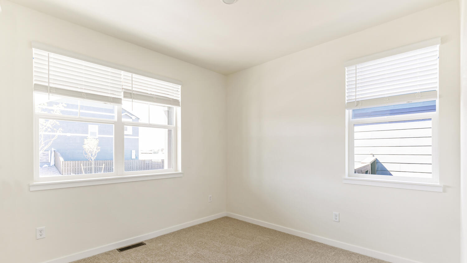 Additional bedroom located in the front of the home with ample natural light from windows