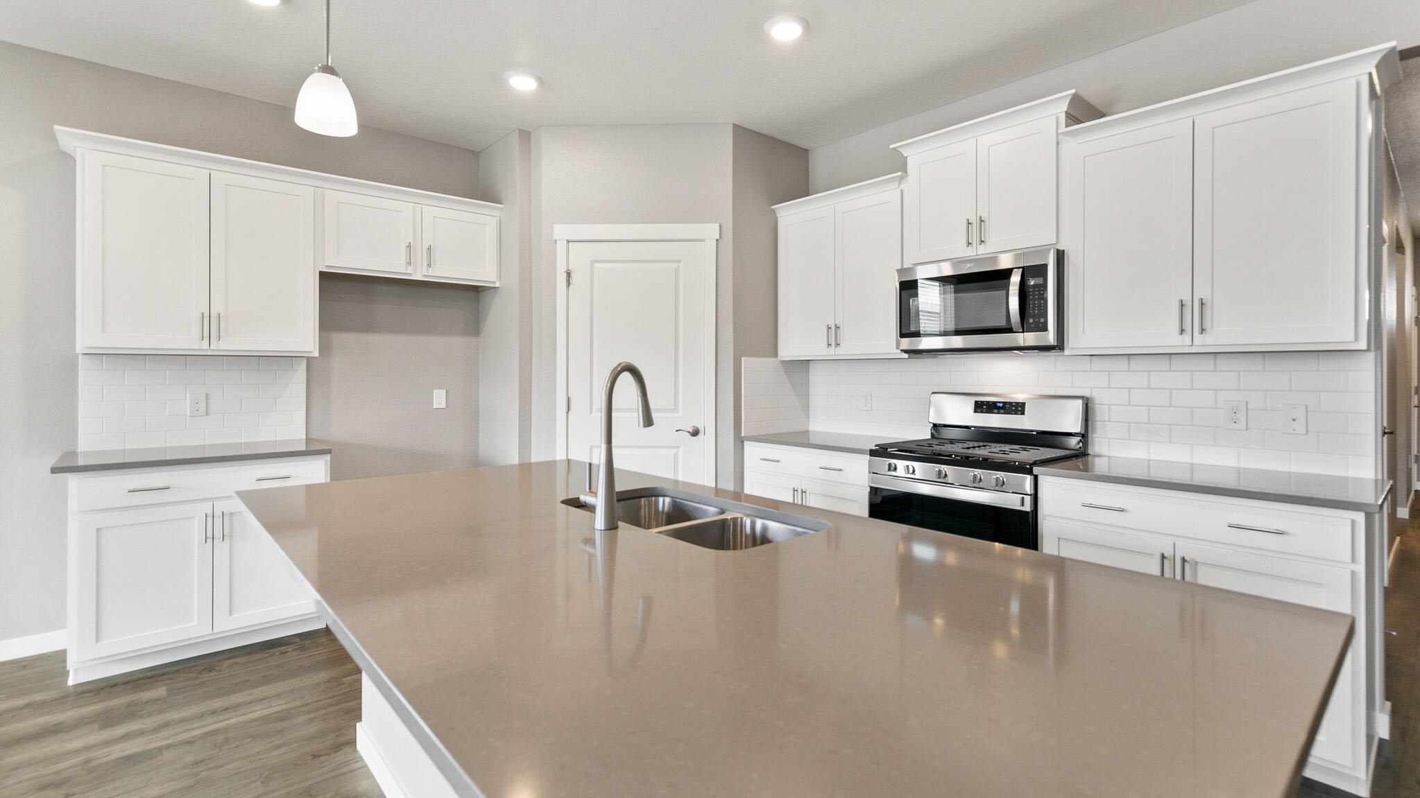 large kitchen island in new construction home by d.r. horton elizabeth, co