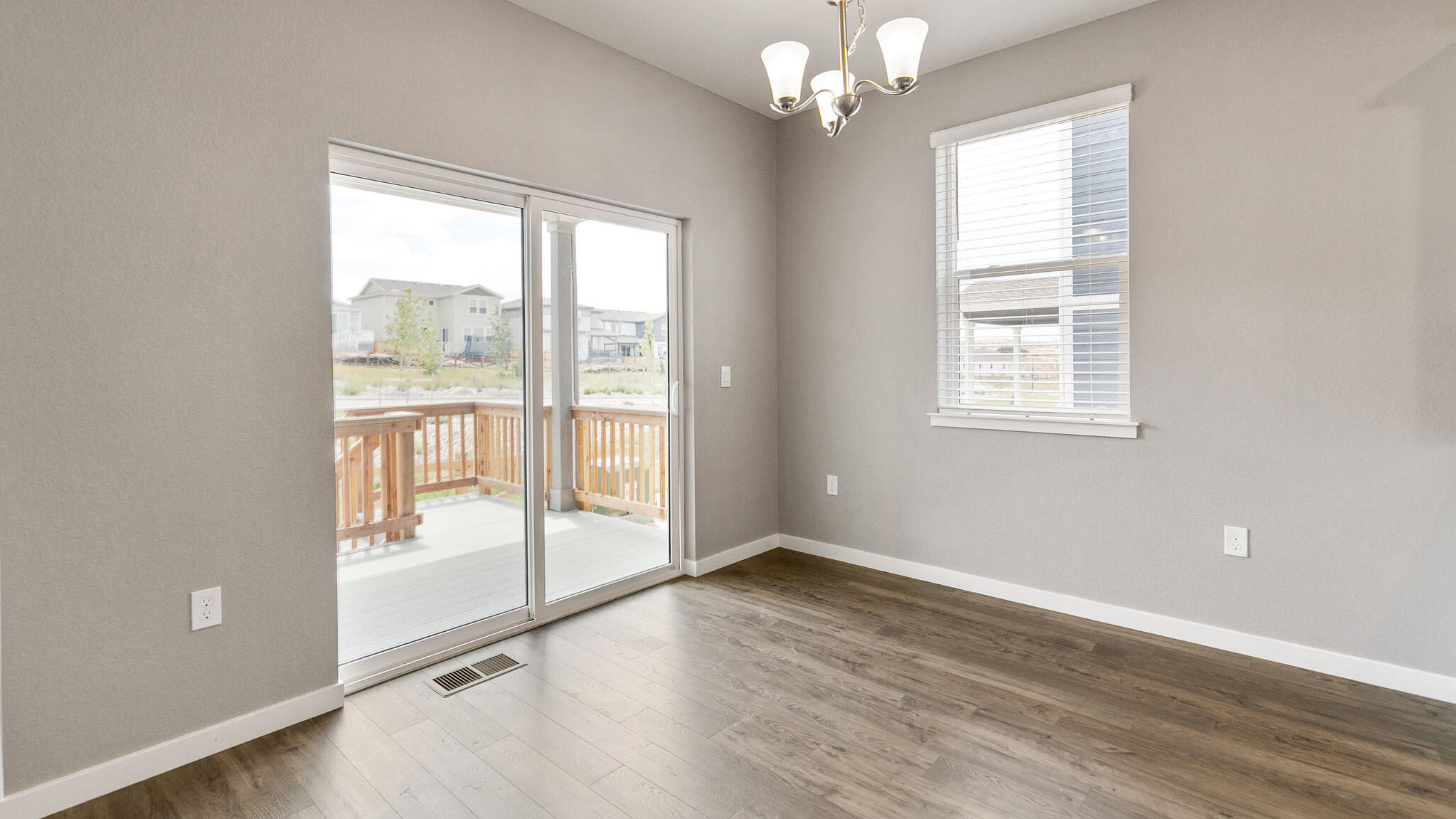 dining room with sliding glass door in new construction home elizabeth, co