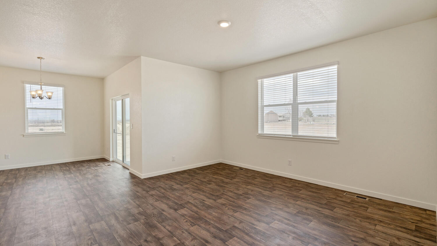 Dining nook near sliding back patio doors and spacious great room