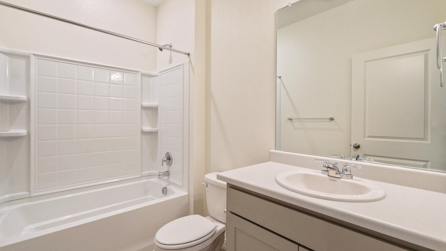 Additional bathroom shared by secondary bedrooms with shower/tub combo