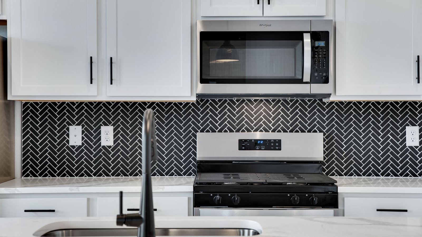 white cabinets and stainless steel appliances in new construction home elizabeth, co