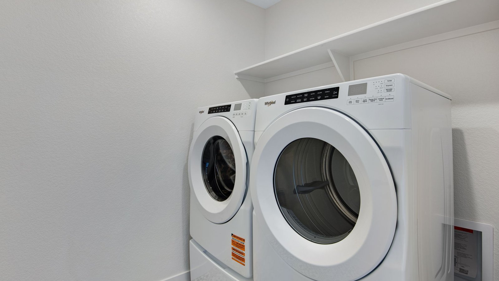laundry room with front load washer and dryer