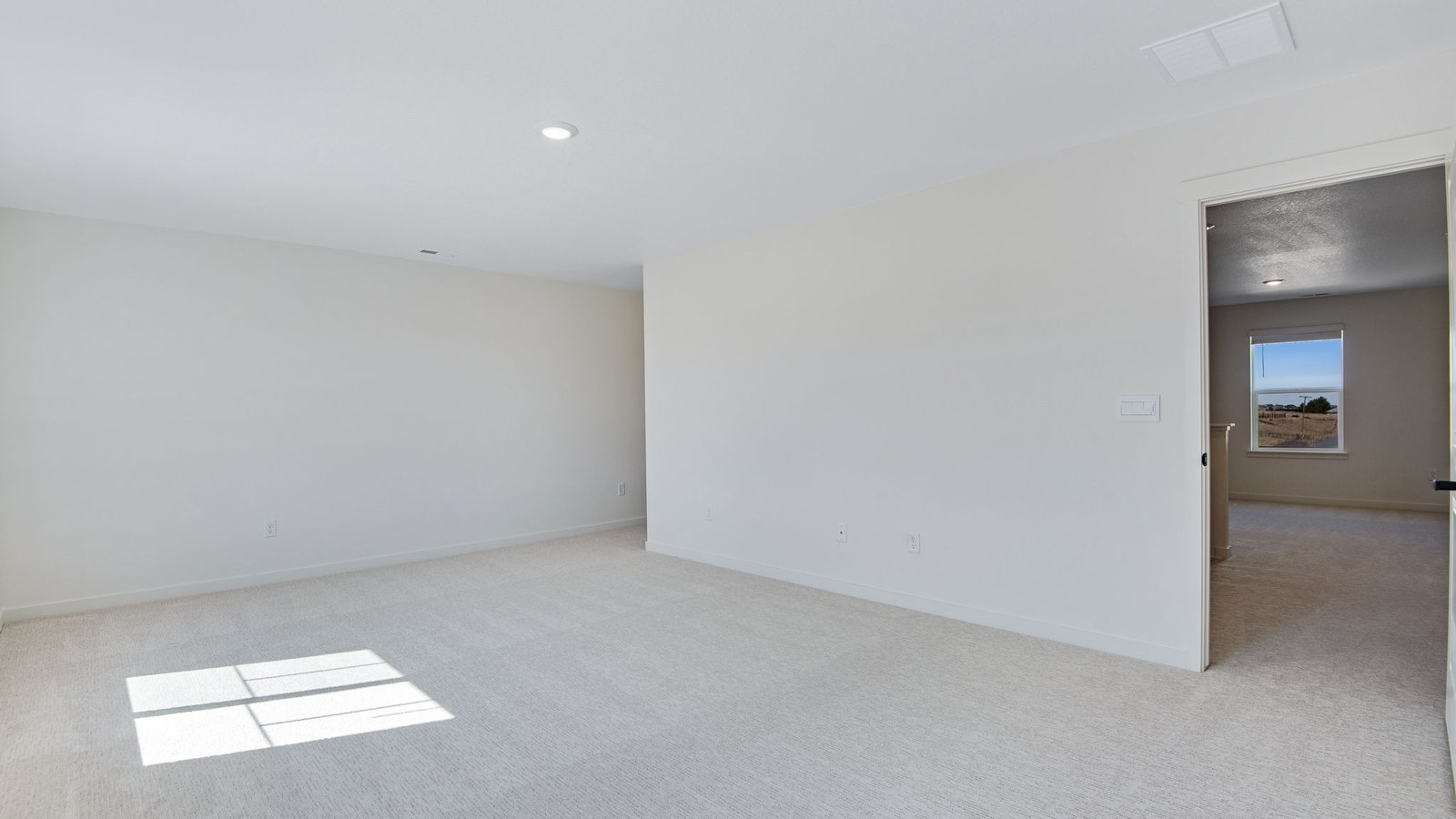 Spacious primary bedroom in new home at Spring Valley Ranch community