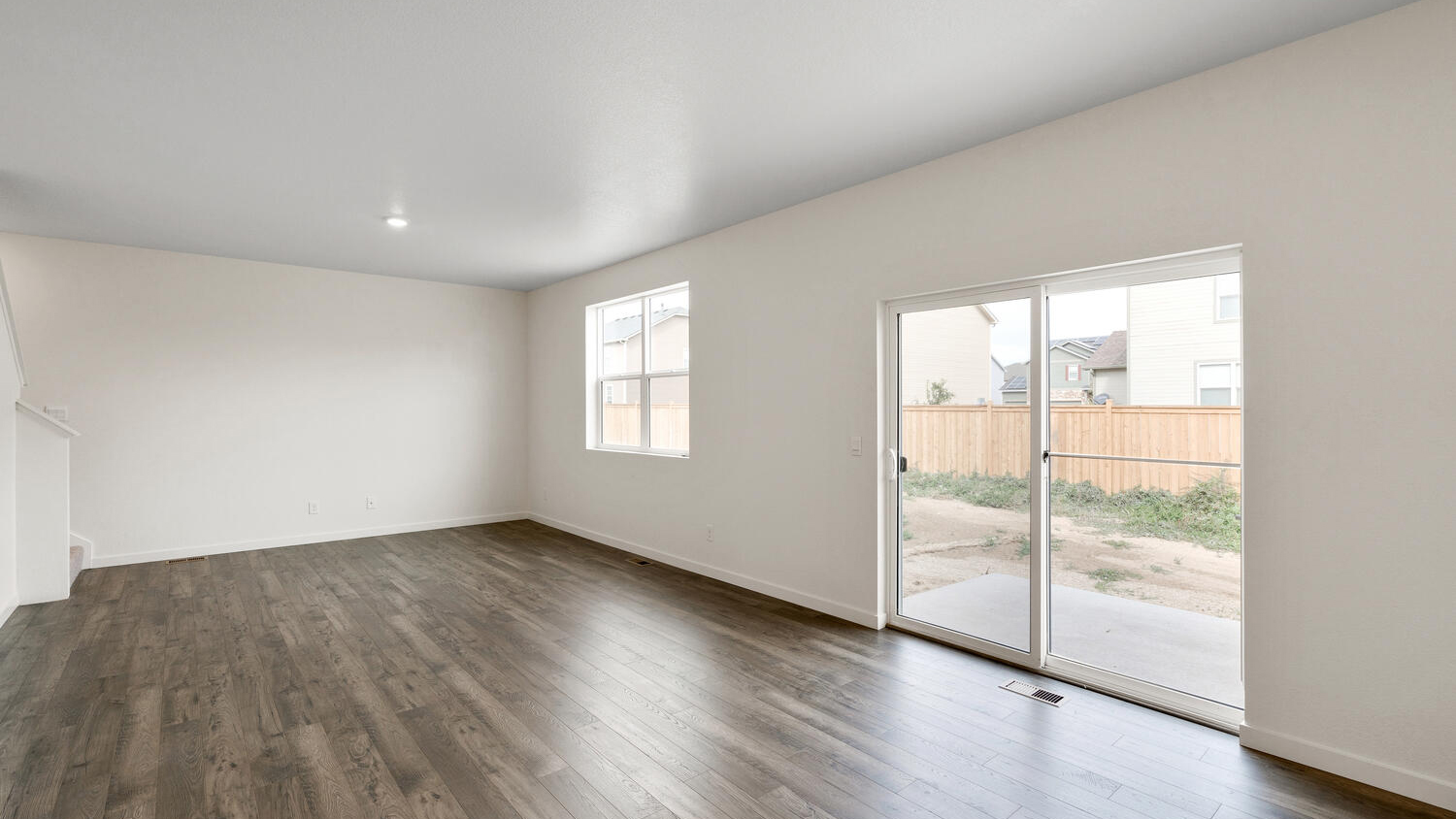 Sliding outdoor patio door in dining nook and great room