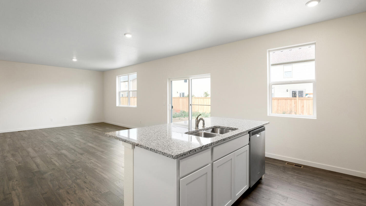 Open and integrated kitchen, dining area, and great room with ample natural light