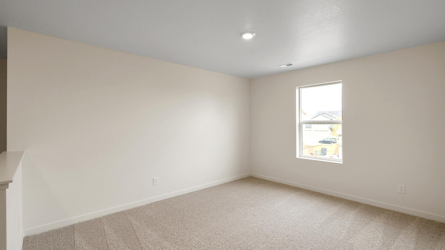 Large loft located at top of stairwell on upper floor