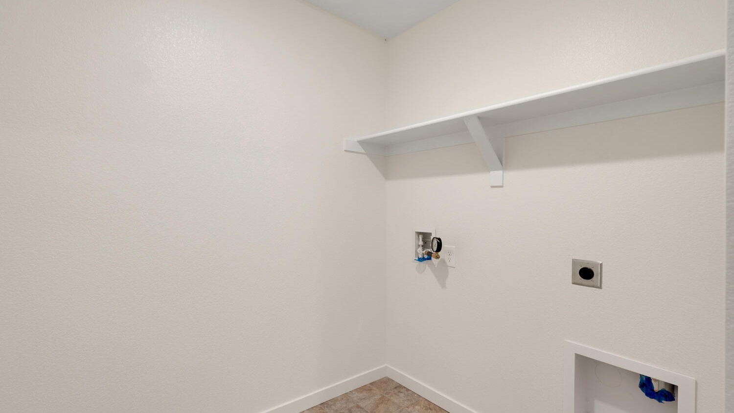 Laundry room with full size washer/dryer hookups and optional built-in shelf