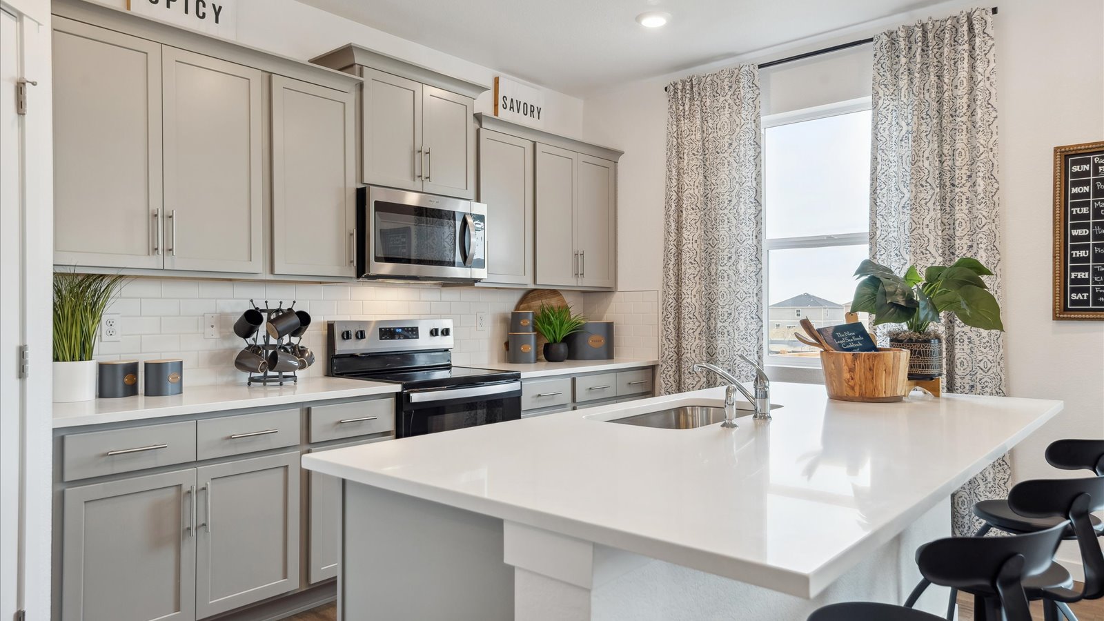 Kitchen with stainless steel appliances in new home