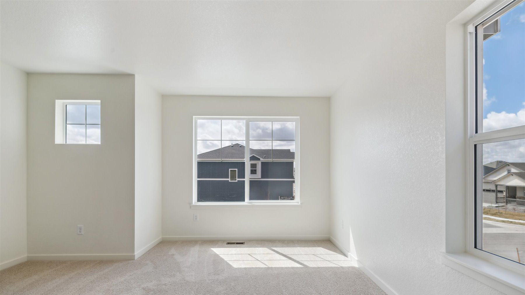 Bedroom with large windows in new D.R. Horton home in Elizabeth, Colorado