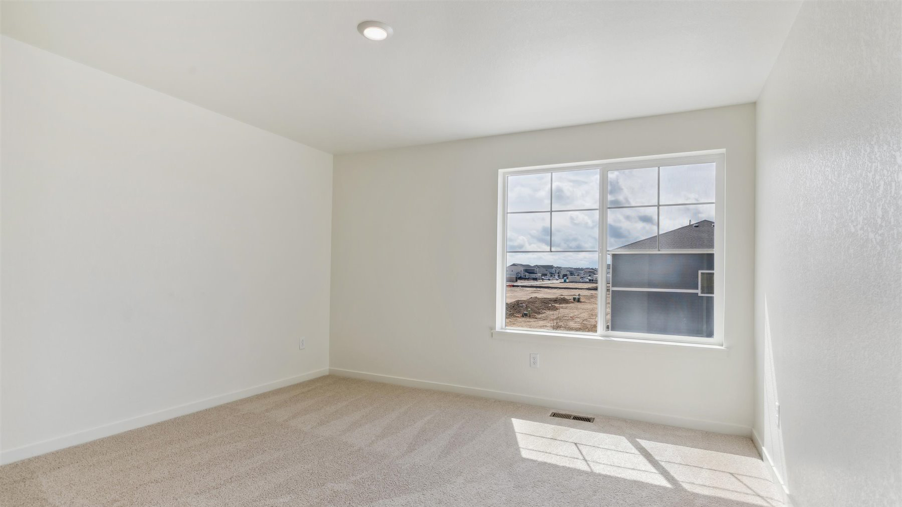 Secondary bedroom with large windows in new D.R. Horton home in Elizabeth Colorado