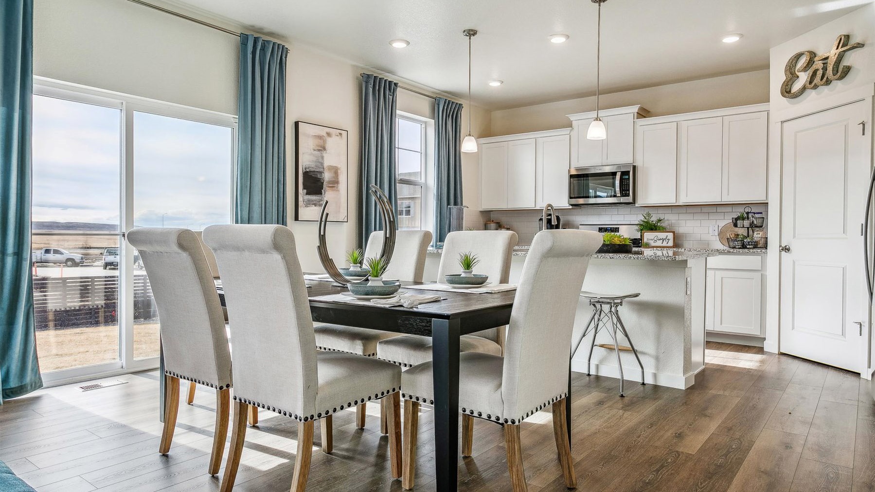 Kitchen and dining area and outdoor access through sliding patio door
