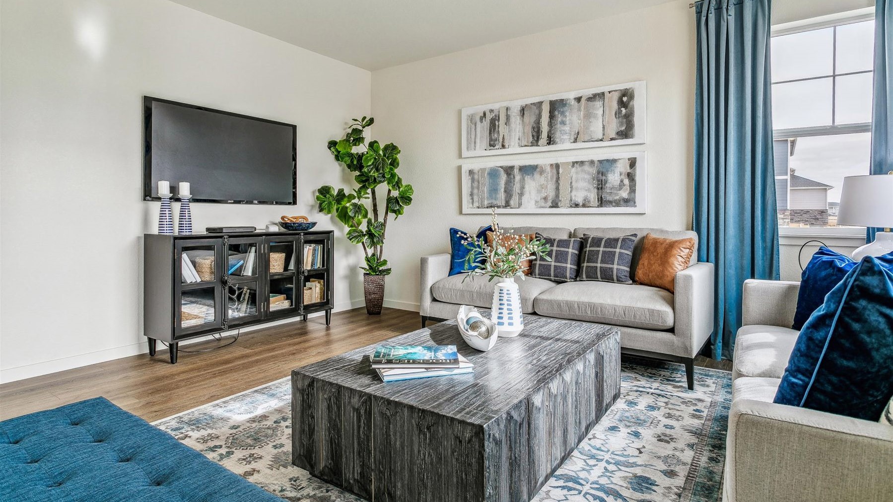 Alternate view of great room with open-concept layout and ample natural lighting