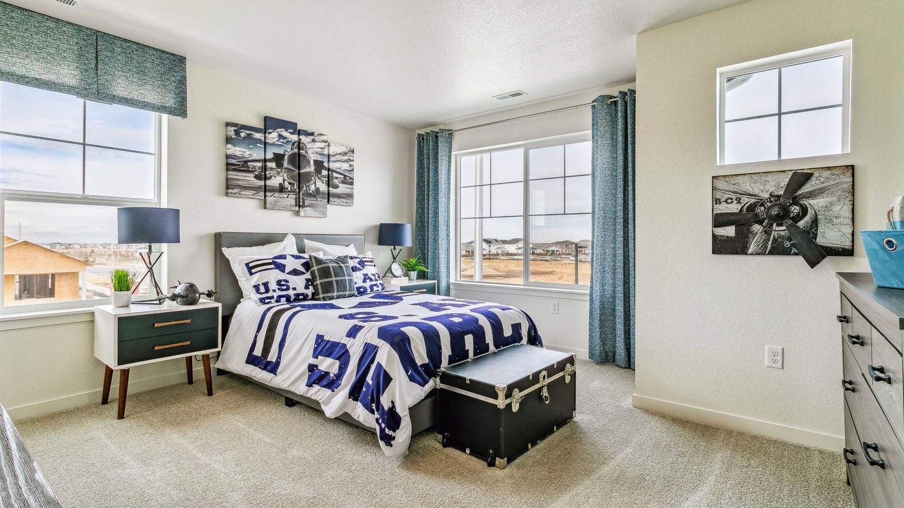 Secondary bedroom with three windows and plenty of natural light