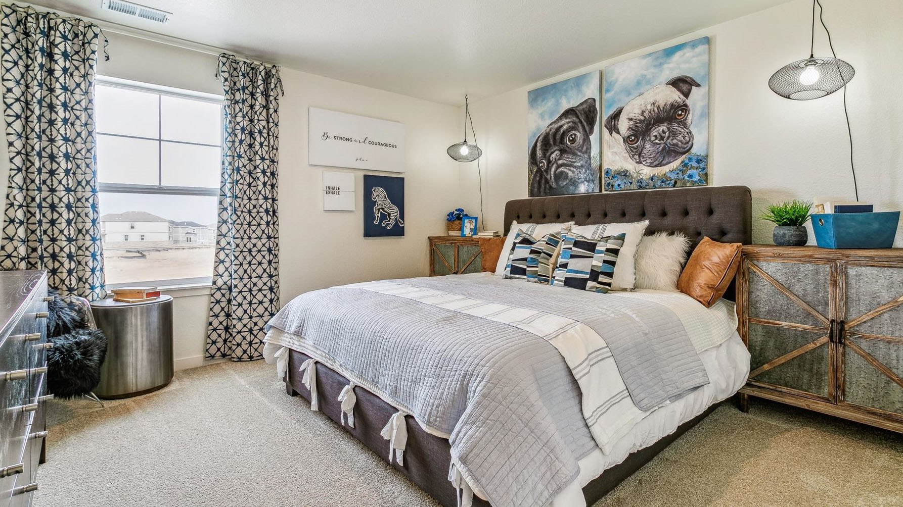 Secondary bedroom near laundry room with walk-in closet