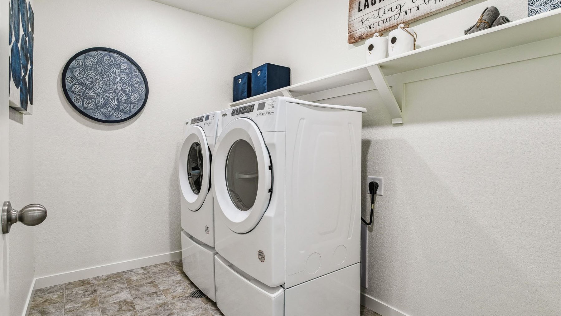 Large laundry room with full size washer/dryer hookups and optional built-in shelving