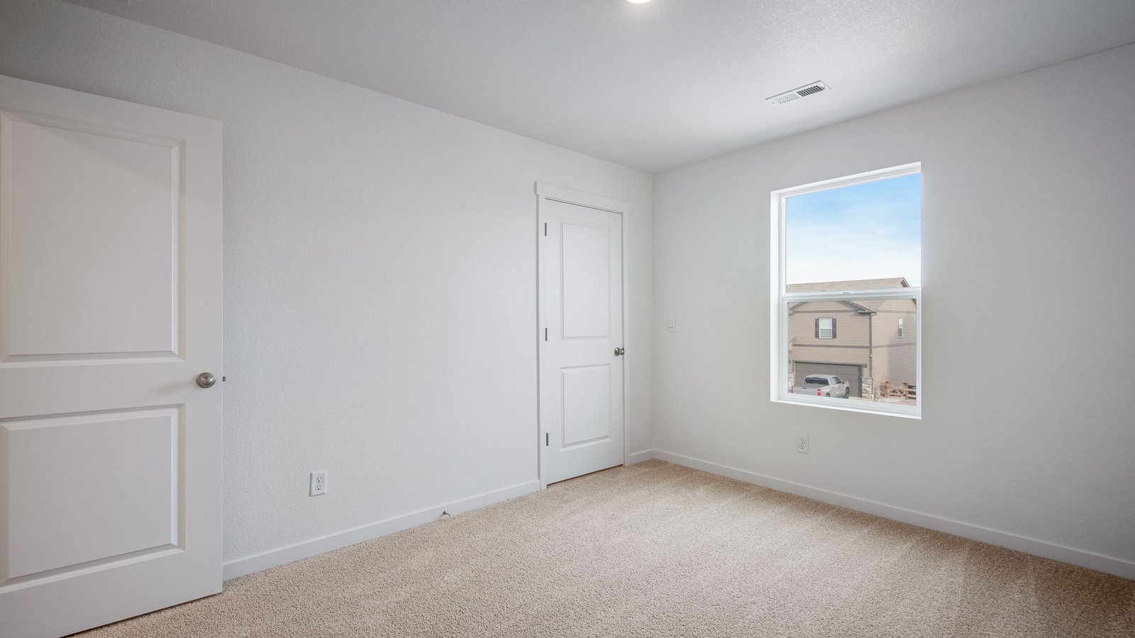 Secondary bedroom with generous closet space in Henley floorplan of new home in Elizabeth Colorado