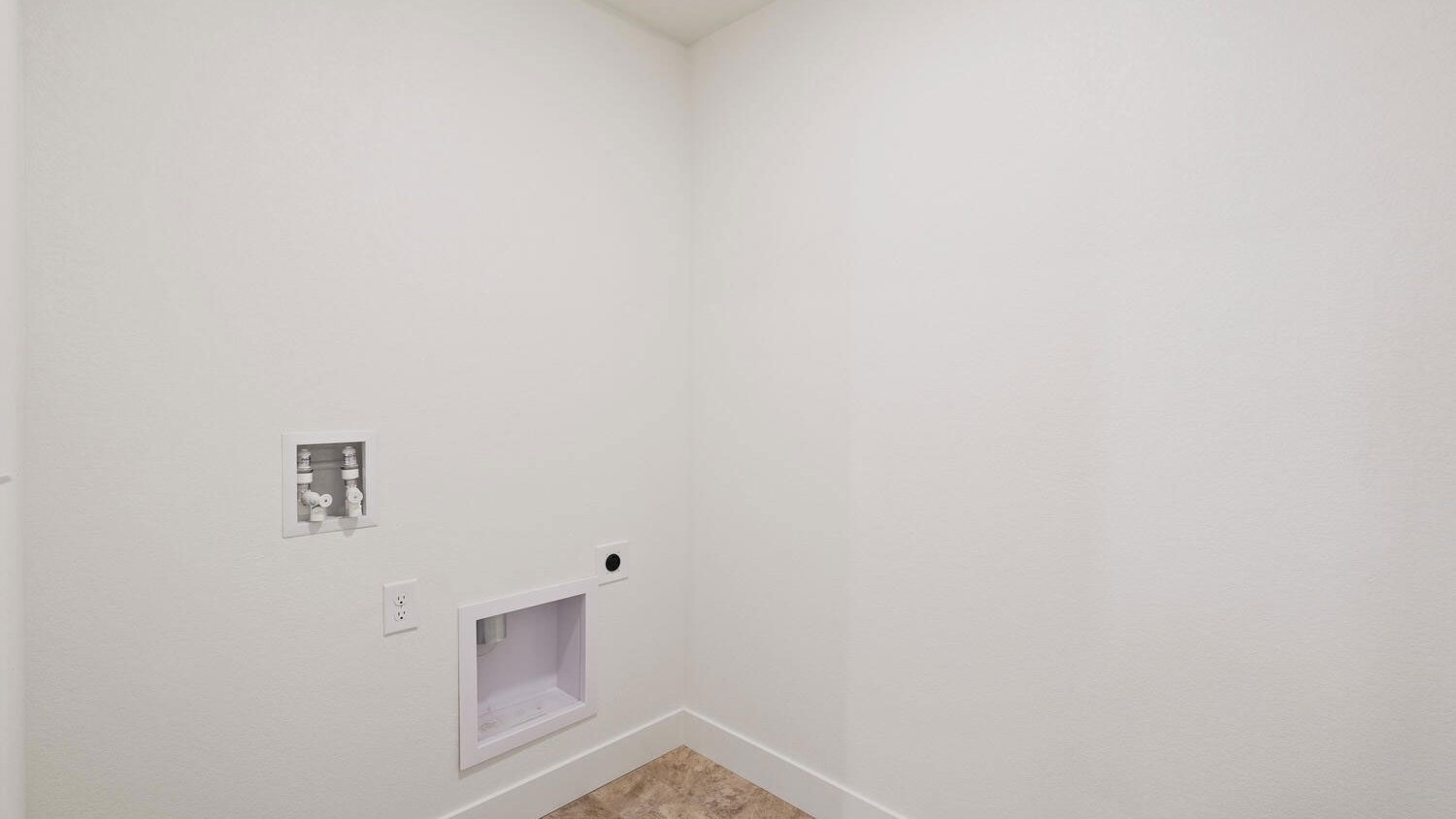 Laundry room showing full washer/dryer hookups