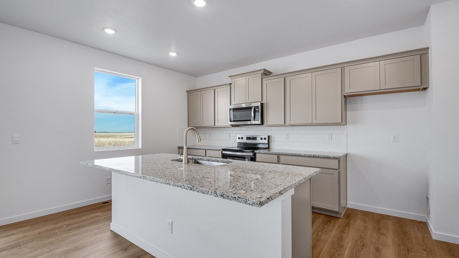Kitchen with island in new home