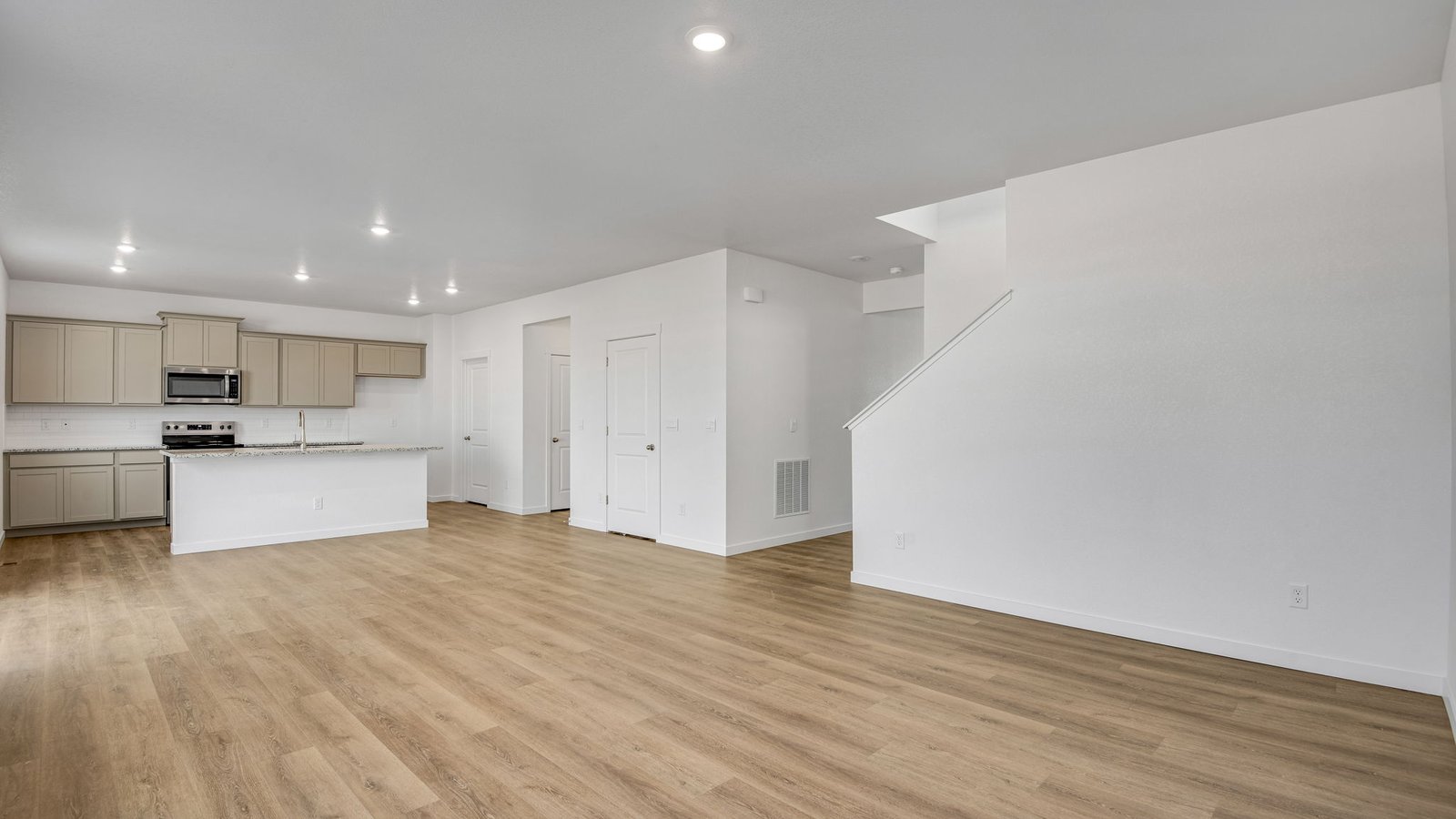 Great room towards kitchen in new home