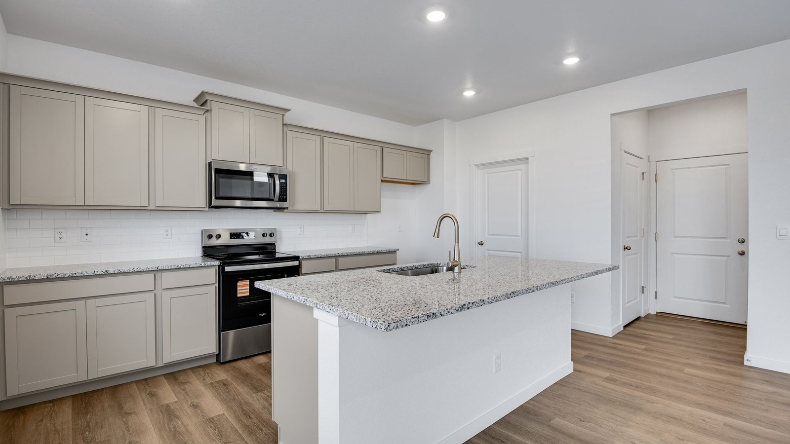 Kitchen with gray cabinets in new D.R. Horton home at Spring Valley Ranch community