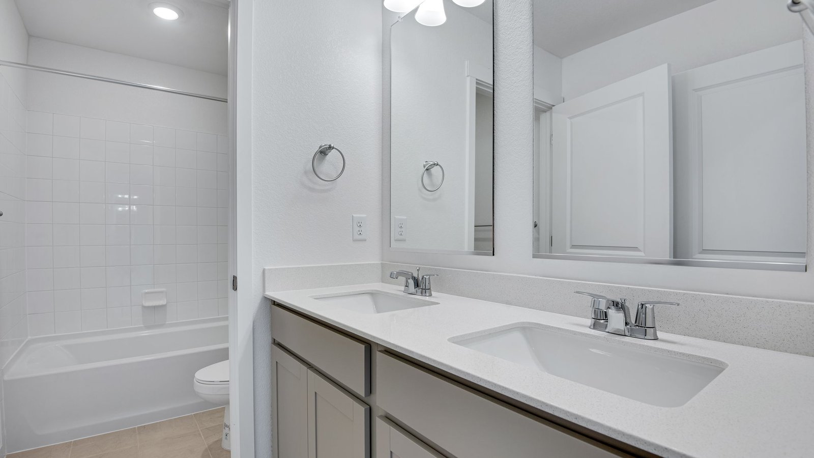 Bedroom with dual vanity sink in new D.R. Horton home in Elizabeth, Colorado