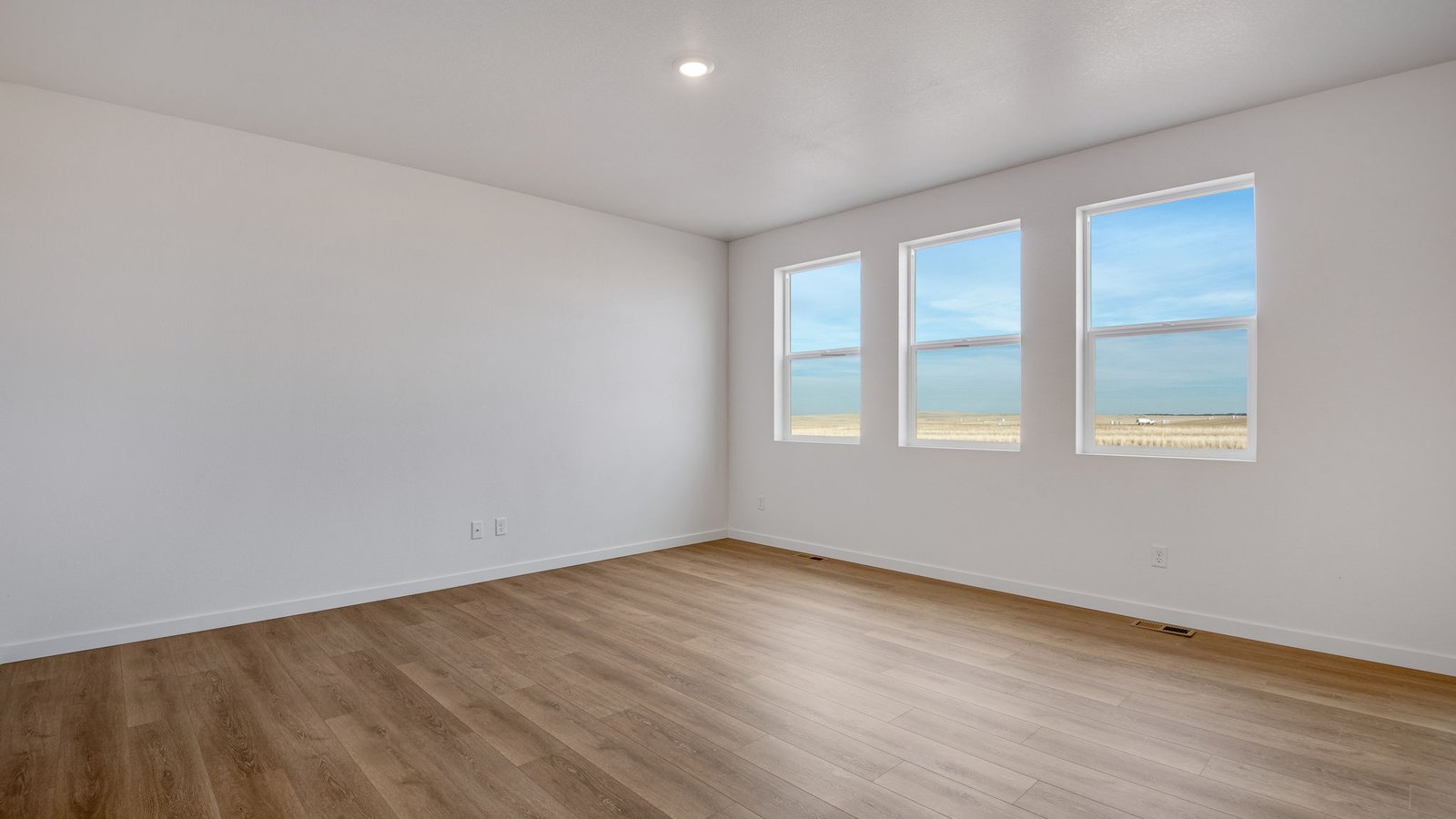Living room with large windows in new home in Elizabeth Colorado
