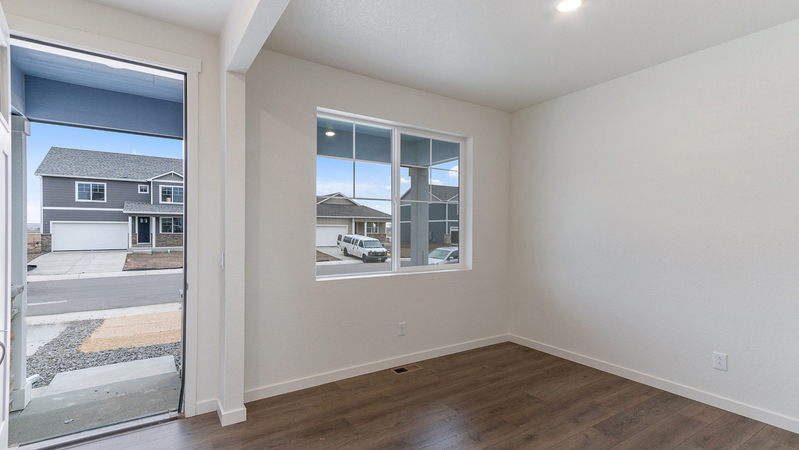 Entryway and large window part of study