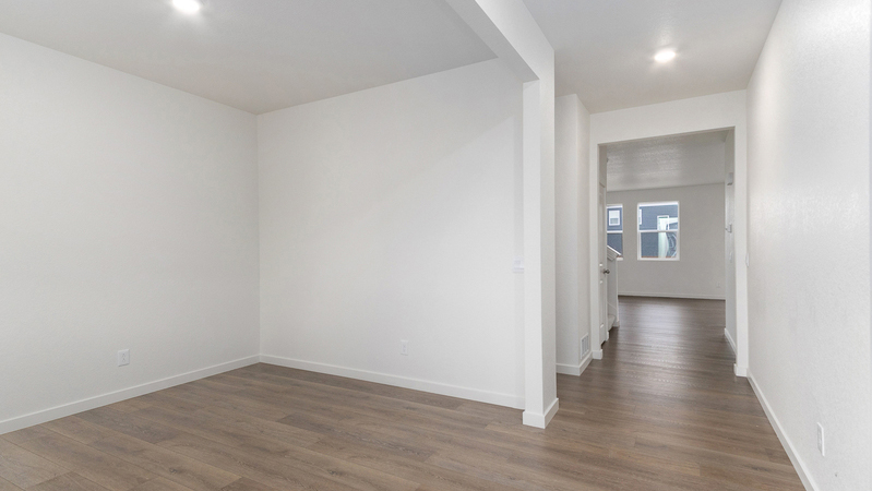 Open study area and foyer with great room past the stairwell