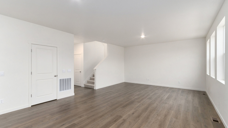 Spacious living area, with connected great room, dining nook, and kitchen