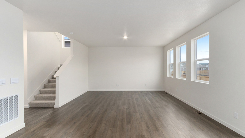 Great room and dining area with three windows for ample natural light