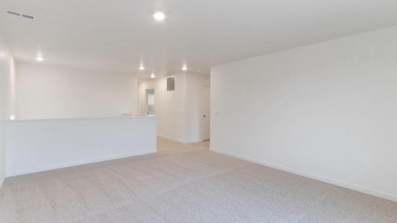 Another view of upstairs living area and stairwell