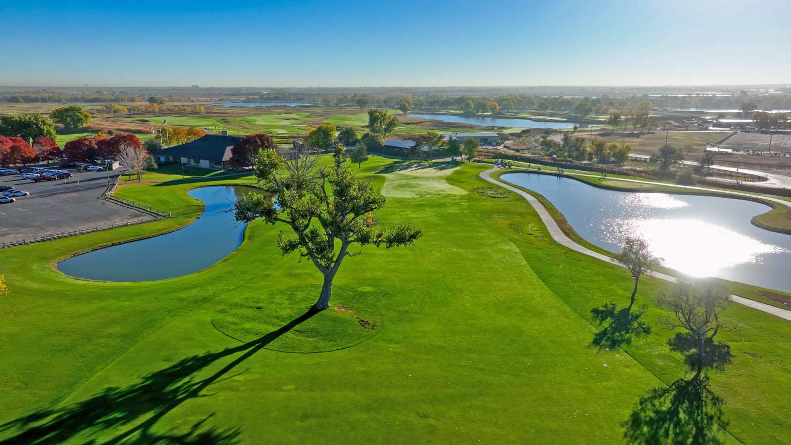 Riverdale Dunes Golf Course with glistening ponds and trees along fairway