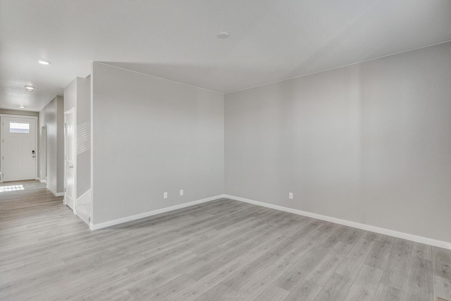 Alternate view of first floor showing foyer hallway and adjoined staircase and closet