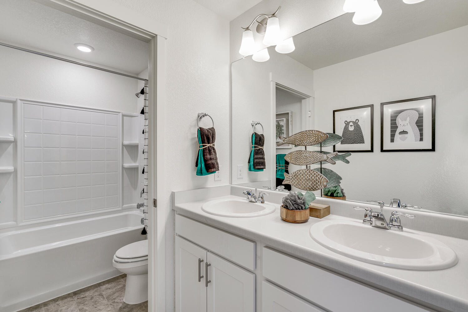 Secondary bathroom with dual sink vanity located on the second floor of Bridgeport plan