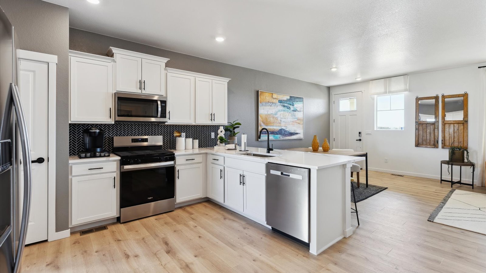 Kitchen with new white cabinets and quartz countertops