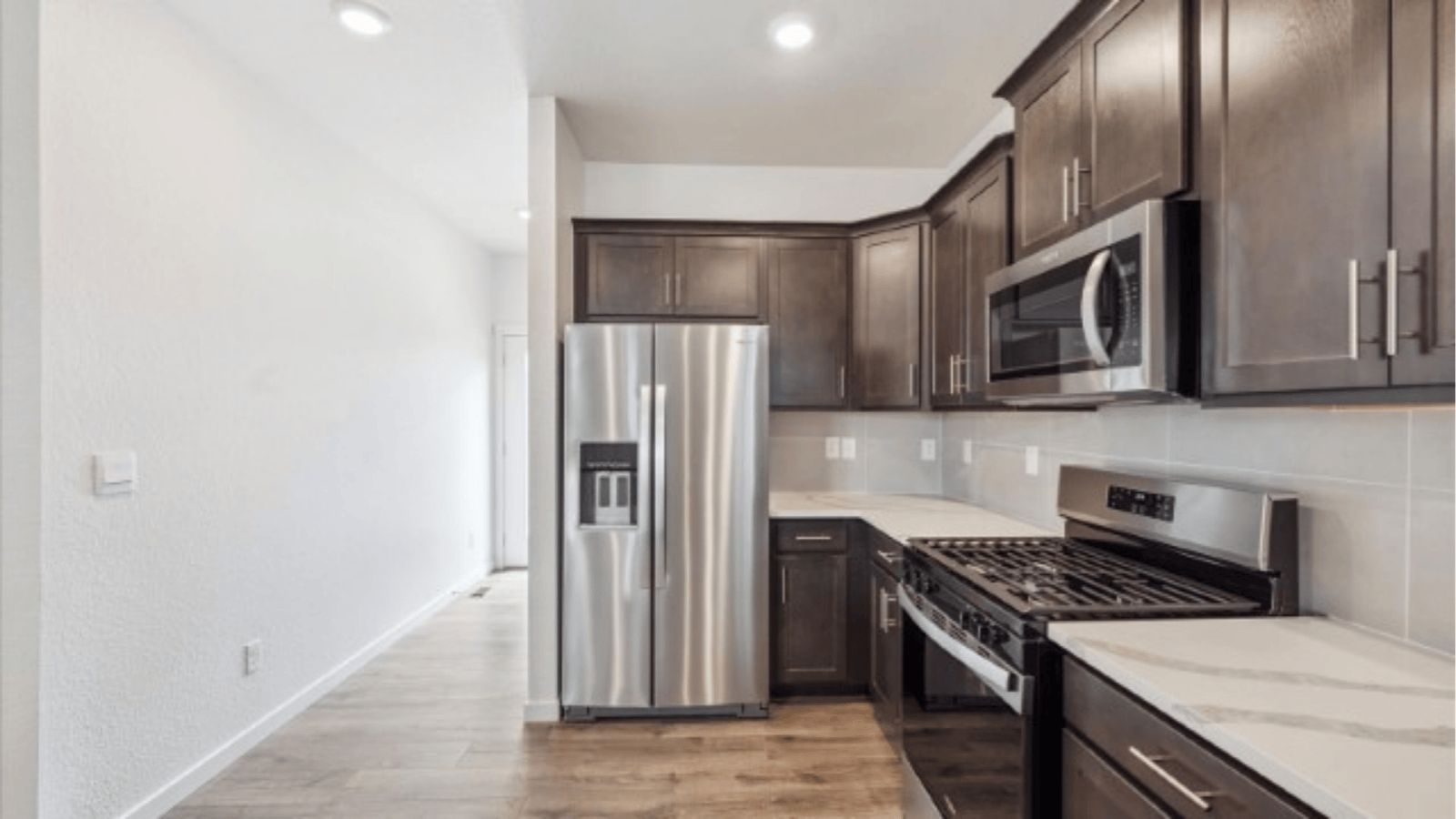 Kitchen with new finishes in home at Horizon Uptown