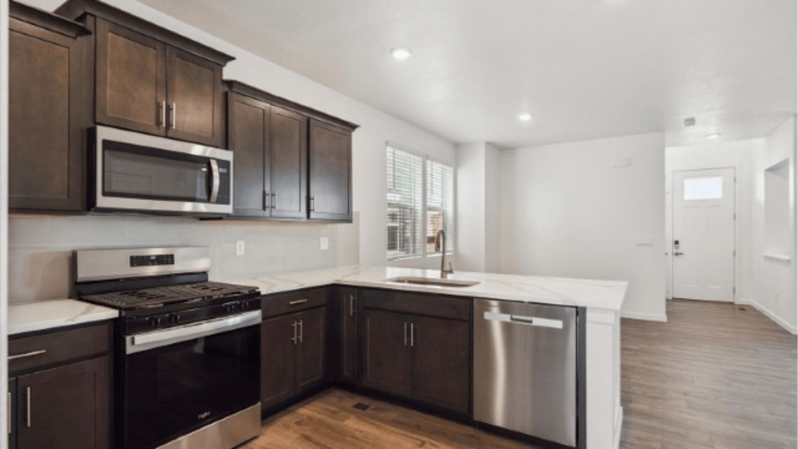 Kitchen with new finishes in home at Horizon Uptown