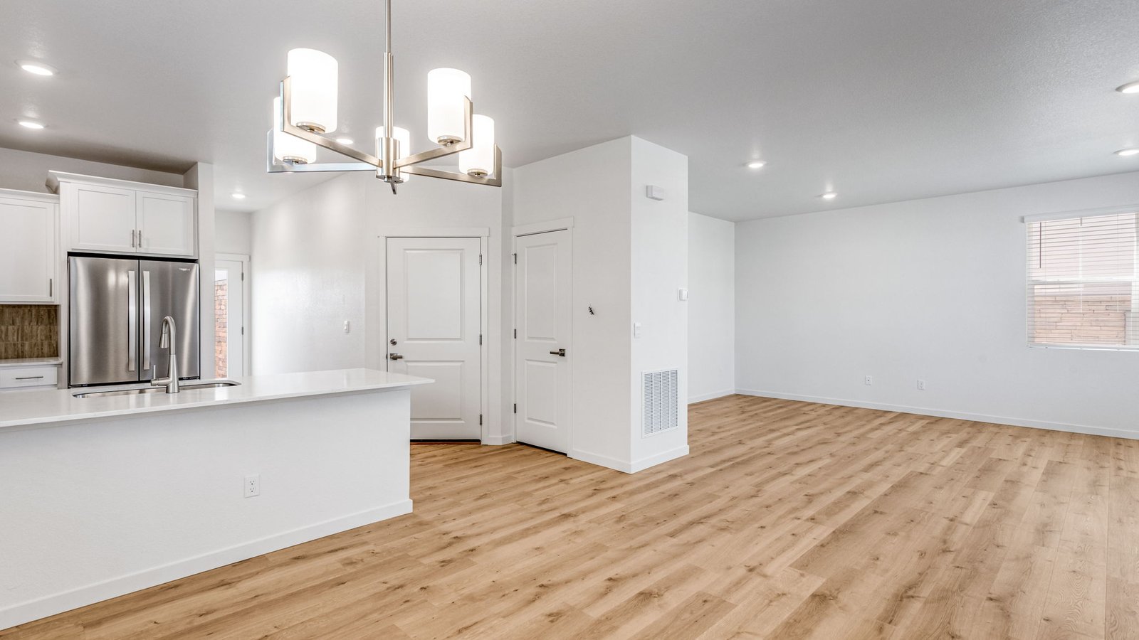 Open concept layout in home at Horizon Uptown near DIA