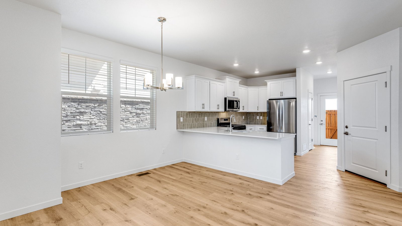 Kitchen area of new home at horizon Uptown community in Aurora Colorado