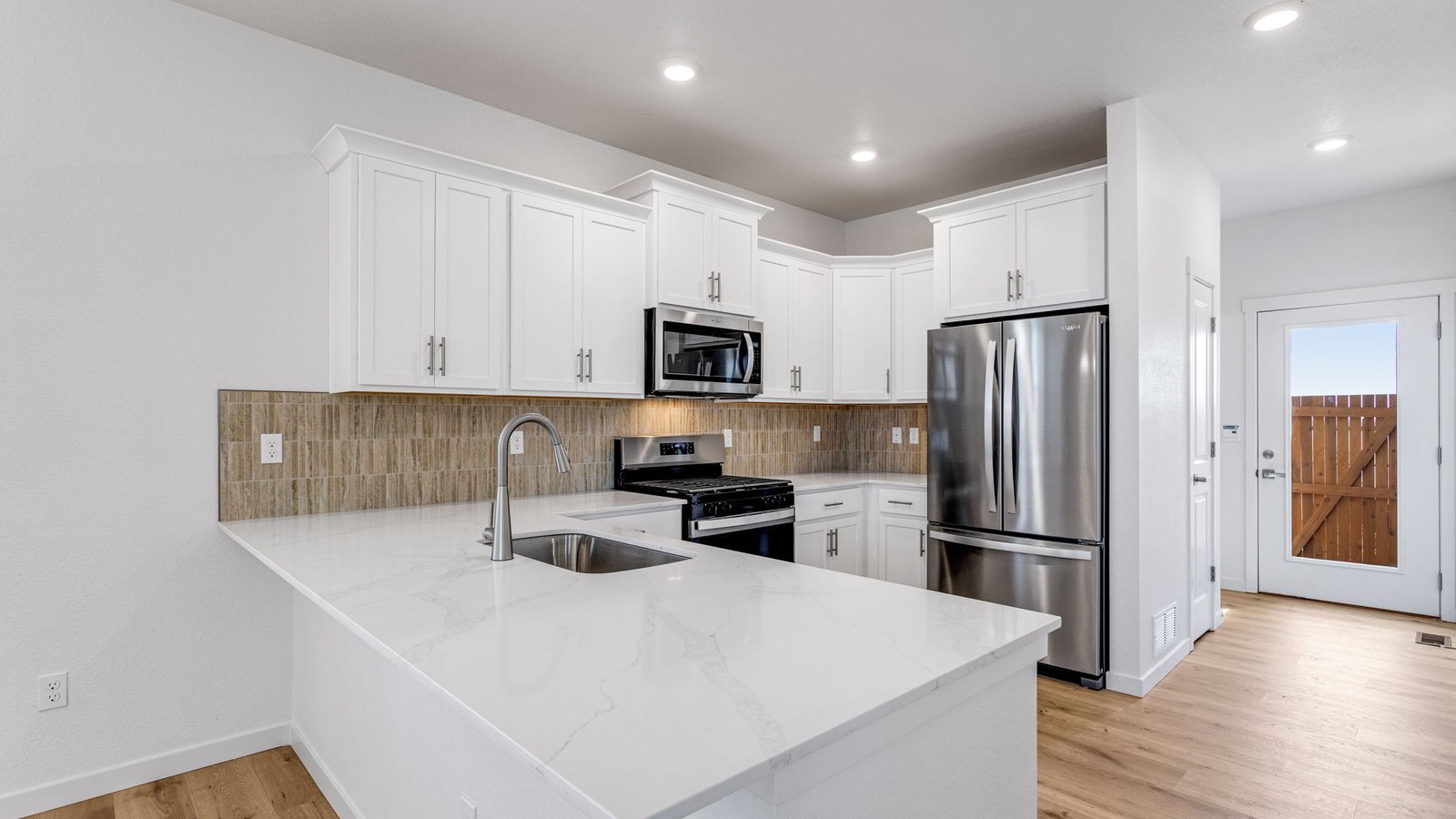 Spacious kitchen island perfect for entertaining in new home in Aurora Colorado