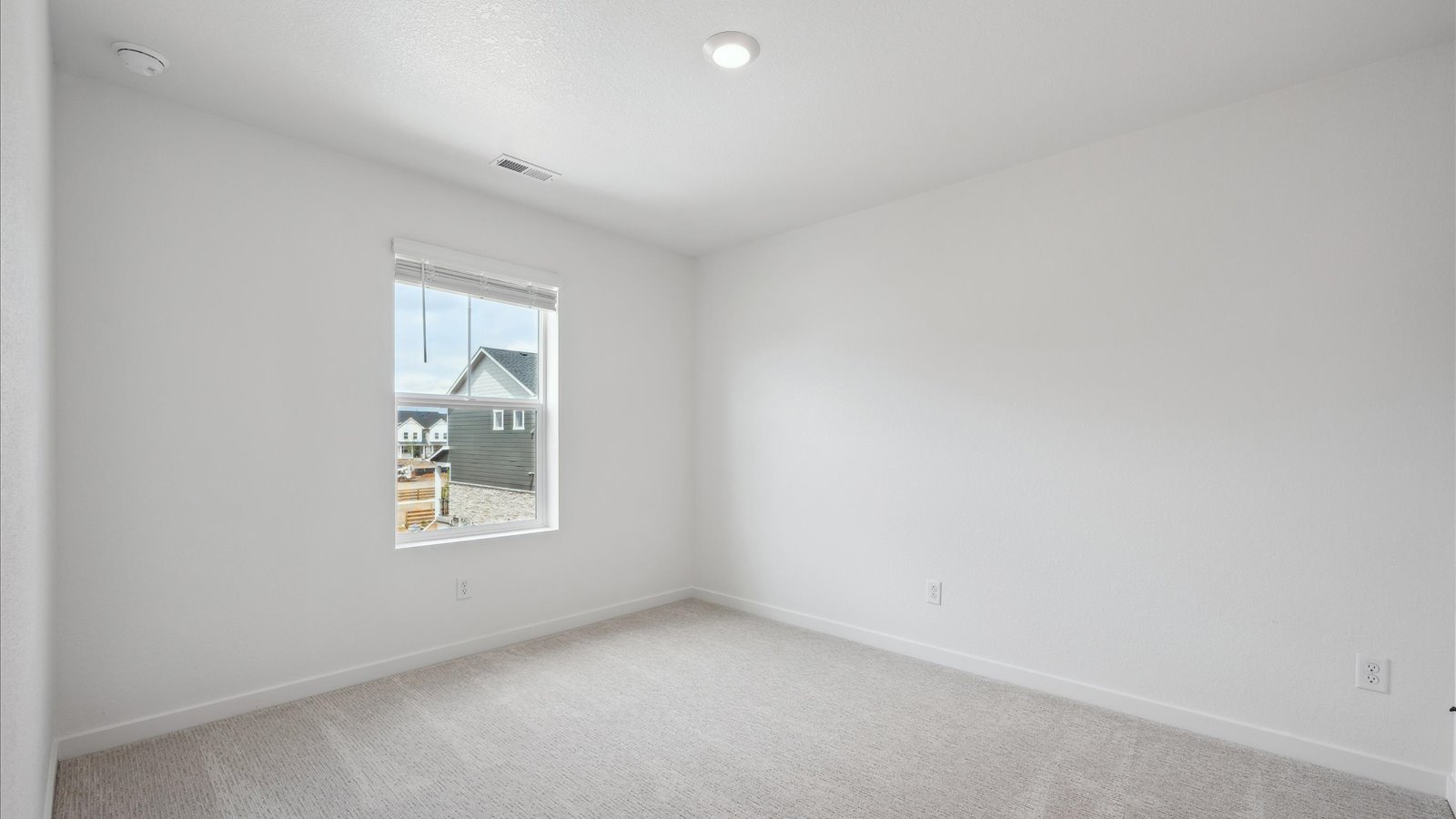Bedroom in the upstairs of the Alamosa floor plan