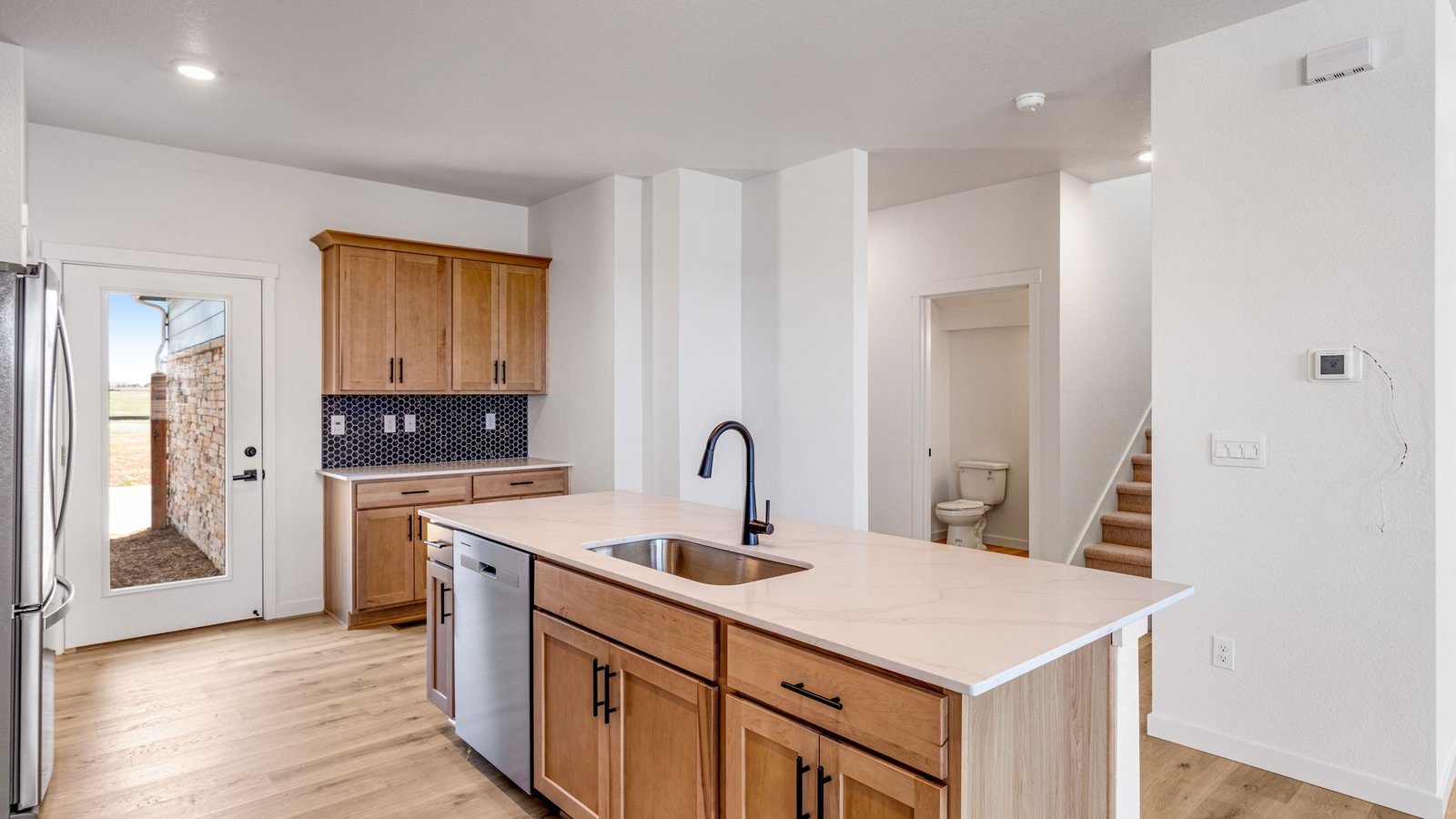 Spacious kitchen island perfecting for entertaining in new home at Horizon Uptown Community