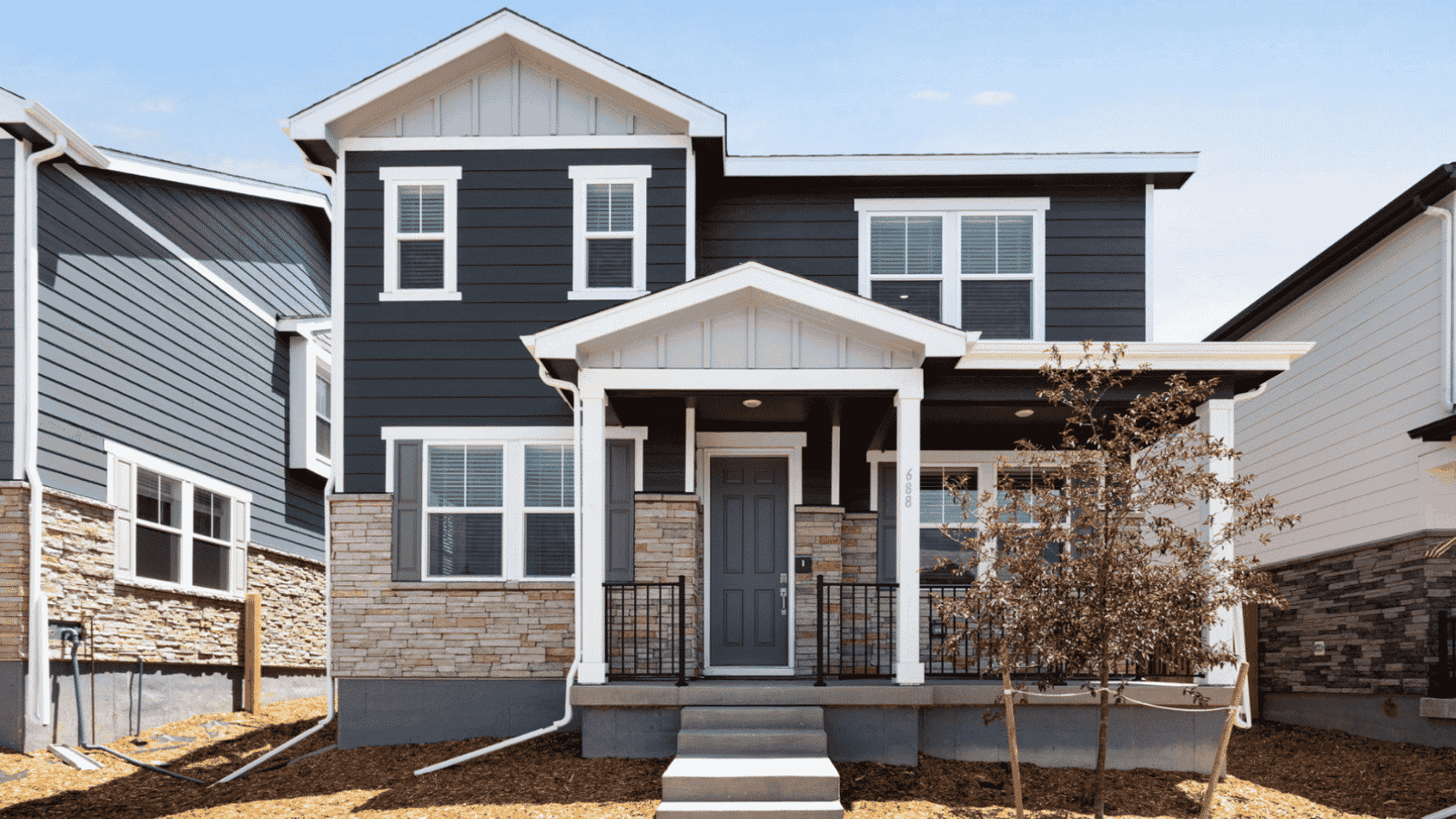 Exterior of two story home in Aurora, Colorado at Horizon Uptown Community