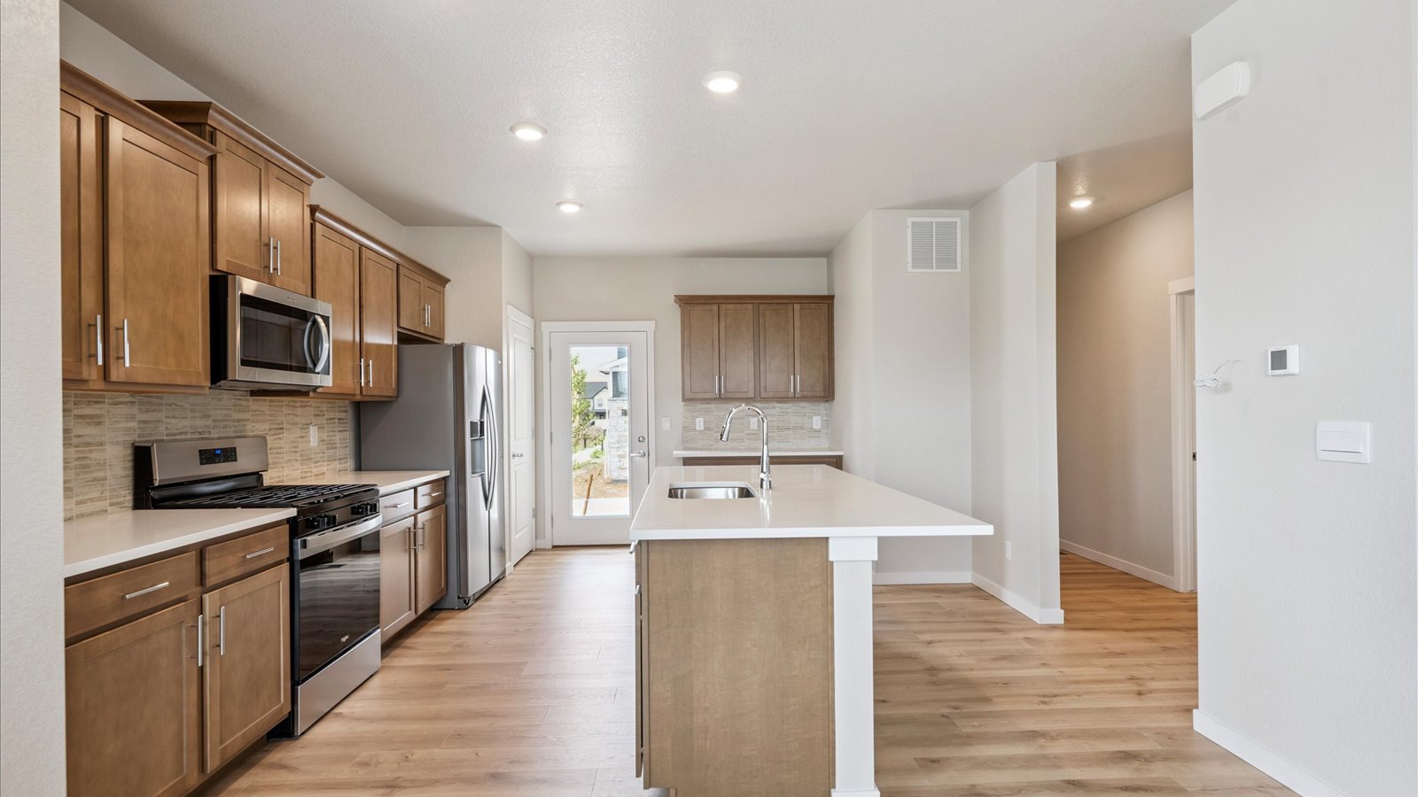 Dining area adjacent to the kitchen in the Elbert floorplan, with space for a full dining table and easy access to the outdoor patio.