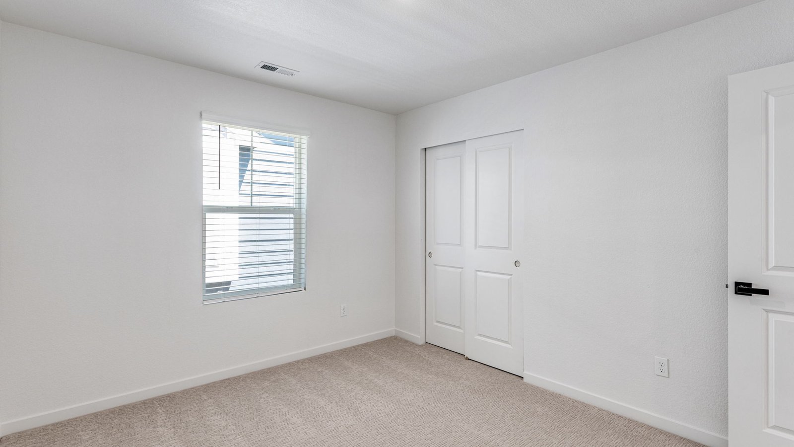 New D.R. Horton home secondary bedroom at Horizon Uptown community